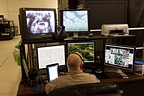 Instructor watching the student conducting a simulator flight