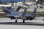 RSAF F-15C Eagle 213 landing at Souda-Chania with in the background USN EP-3 and pair of C-2s on the apron