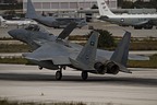 RSAF F-15C Eagle 214 landing on a day with some weather rolling in, on the Souda-Chania apron some US visitors