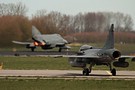 Swedish Air Force JAS 39 Gripen with Luftwaffe F-4F taking off in the background