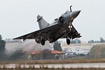 332 Mira Mirage 2000EGM 212 afterburner take-off, with Hellenic Aerospace Industry's facilities in the background