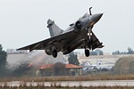 332 Mira Mirage 2000EGM 212 afterburner take-off, with Hellenic Aerospace Industry's facilities in the background