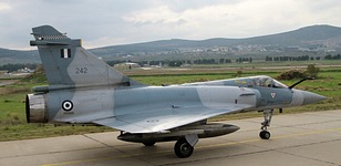332 Mira Mirage 2000EGM 242 seen with Tanagra runway 10 and the facilities of Hellenic Aerospace Industry in the background