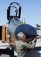 Commander of 348 Squadron, lieutenant colonel Dimitris Papadimitriou showing his affection for the RF-4E Phantom II