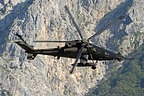 An AH-129D Mangusta flies over the action area to protect the soldiers operating on the ground