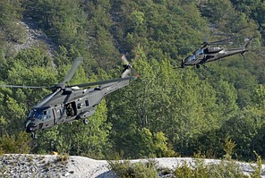 UH-90A approaching the insertion zone, escorted by an AH-129D Mangusta