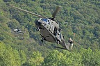 UH-90A approaching the ground under cover of the AH-129D Mangusta in the background