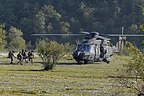 Elements of the 66° Reggimento Fanteria Aeromobile move fast towards the UH-90A with the injured AH-129 pilot on the stretcher
