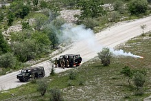 The VM90 vehicles and ground troops popping smoke to confirm their location to the helicopters