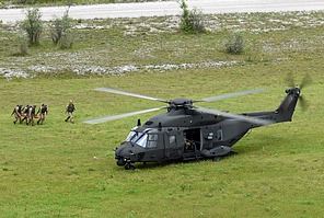 The casualty being carried to the UH-90A