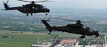 AH-129C UH-90A formation returning to base