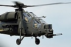 AH-129C close-up as it flies in formation with the camera-ship