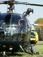 Belgian Marine Alouette III close-up, note the winch and floats, with Royal Netherlands Air Force AB-412SP sitting in the background.