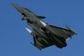 Arme de l'Air Rafale on take-off carrying three drop tanks.