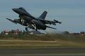 Norwegian F-16AM taking off carrying AIM-120 AMRAAM, IRIS-T, and ALQ-131 jammer.