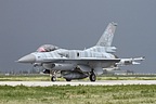 Polish Air Force 6.ELT F-16C Block 52+ 4052 in light blue/grey tiger scheme pictured against the thunderstorm