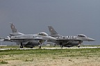 Two more Polish F-16Cs 4040 and 4060 lined up against the dark sky