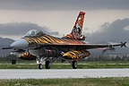 Beautiful shot of the colourful 192 Filo F-16C Tiger Special against the dark clouds
