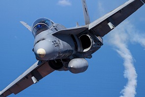 EF-18BM Hornet dropping flares as it breaks away from the A400M