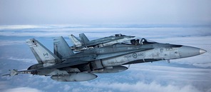 Pair of Canadian CF-188 Hornets meet up with the C-27J