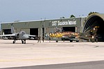 Italian Air Force AMX taxiing past the Su-22UM-3K.