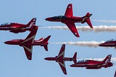 RAF Red Arrows break formation for landing